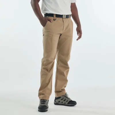 Model wearing khaki men’s hiking pants for outdoor trekking, showing relaxed fit and performance design.