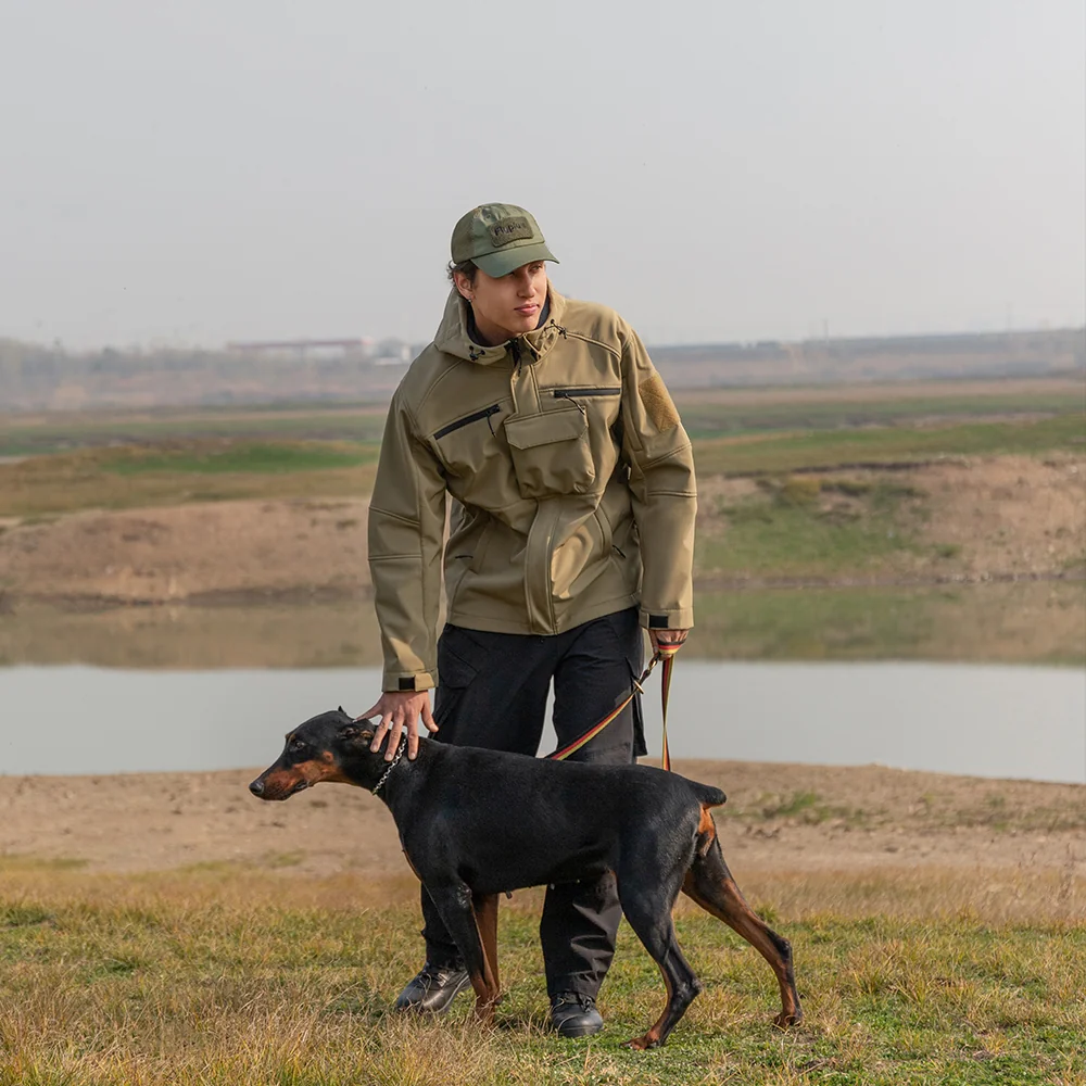 Man wearing waterproof jacket while walking dog outdoors, showing waterproof and windproof functionality in real use.