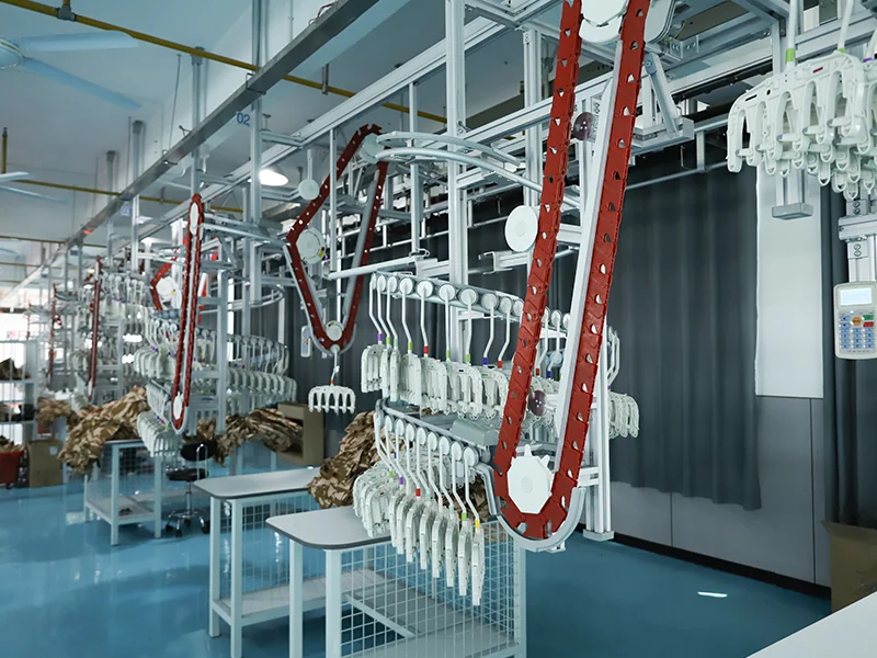 Automated hanging conveyor system used in WHFrontend’s garment production line, ensuring efficient workflow and consistent quality.