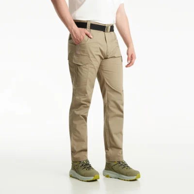 Model wearing khaki waterproof hiking cargo pants with breathable quick-dry material and tactical pockets for hiking and travel.