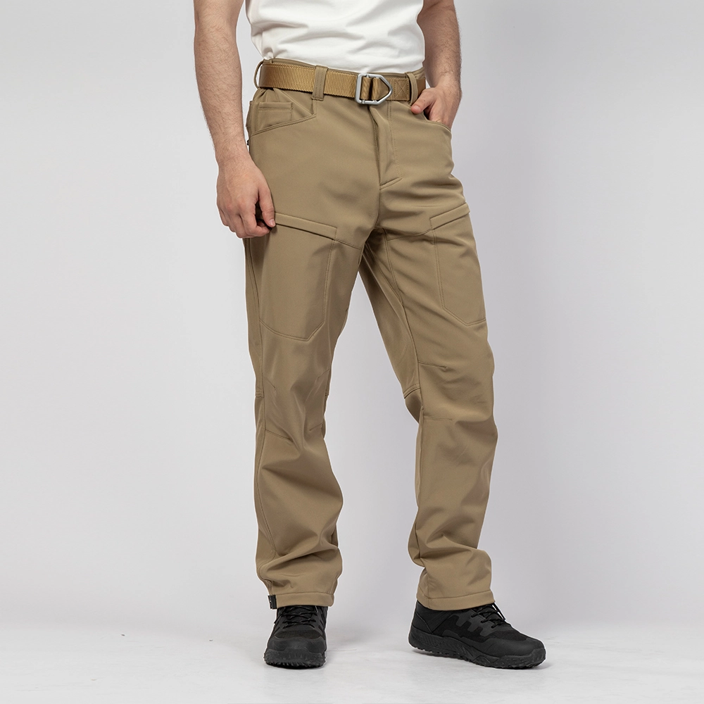 Model wearing khaki hiking pants showing ergonomic design and lightweight comfort for outdoor adventure.