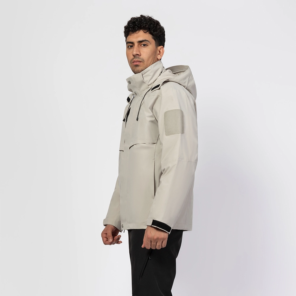 Beige 3 in 1 waterproof jacket for men, side view with adjustable hood and chest pockets, ideal for hiking, travel, and daily outdoor wear.