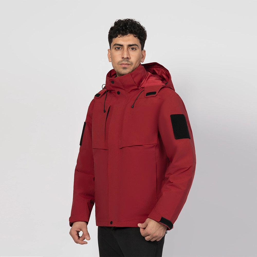 Red men’s 3 in 1 waterproof jacket modeled for front view, featuring windproof shell, detachable fleece lining, and adjustable hood for outdoor protection.