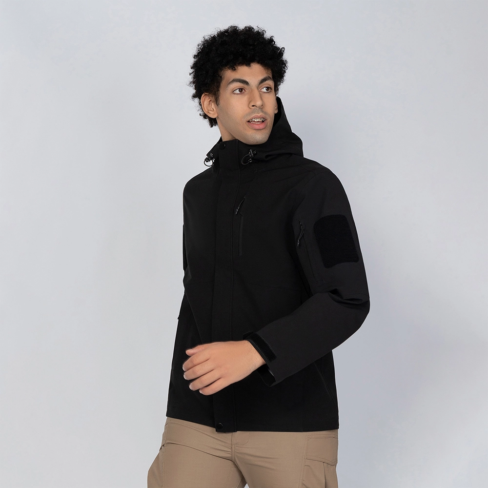 Black waterproof jacket for men shown on model, lightweight and breathable hardshell design with adjustable hood and multi-pocket layout for outdoor protection.