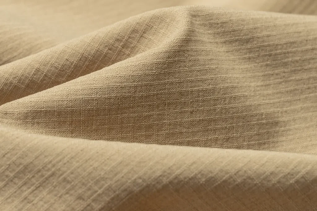 Close-up of ripstop fabric weave used in tactical pants wholesale manufacturing at Frontergroup